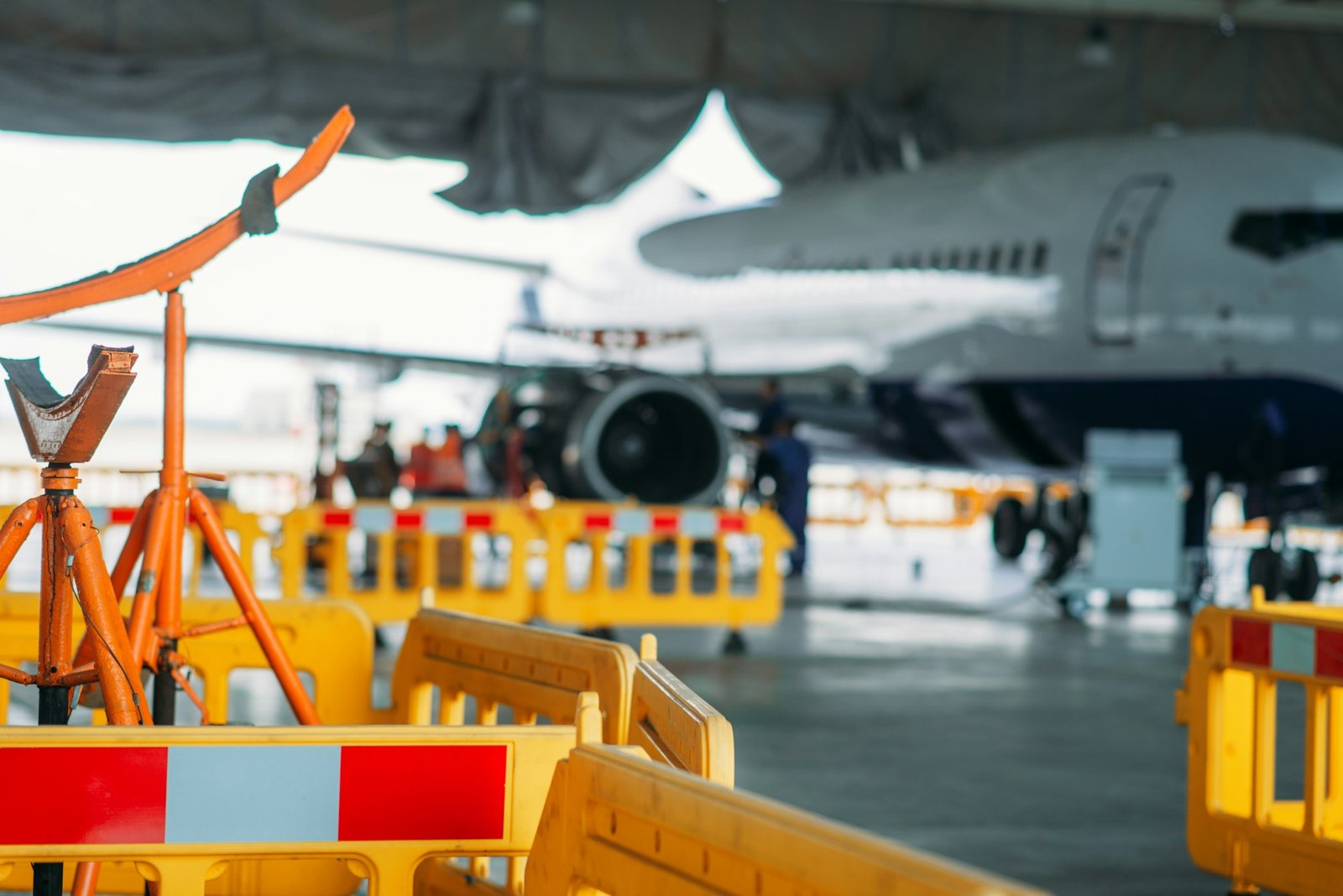 Aircraft engine maintenance in hangar, repairing