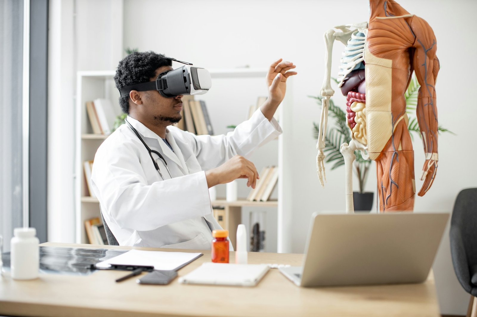 Professor using VR glasses in doctor's office in clinic